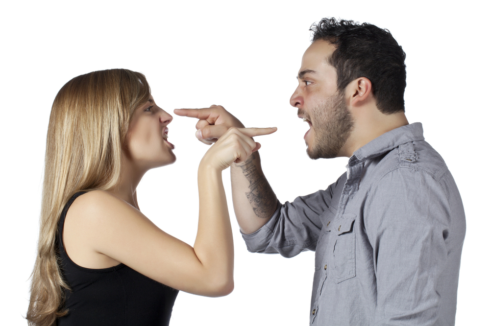 Image of couple having an argument against white background